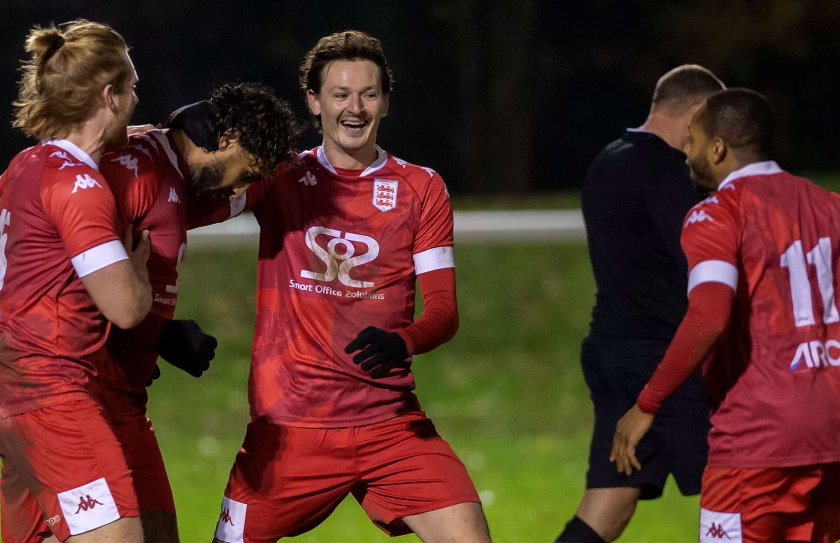 Faversham forward Stefan Payne celebrates scoring the only goal of the game from a free-kick with team-mates Billy Bennett, Finn O'Mara and Kieron Campbell. Picture: Ian Scammell