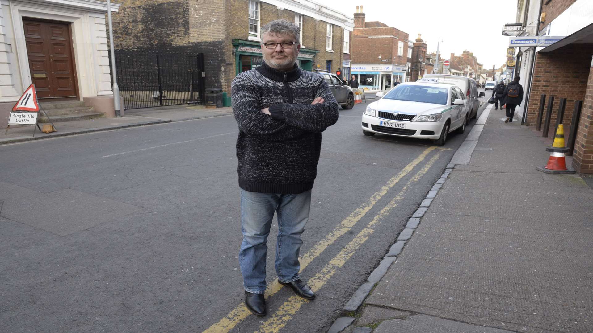 Tony Pout at the entrance to Reeves Taxi's.