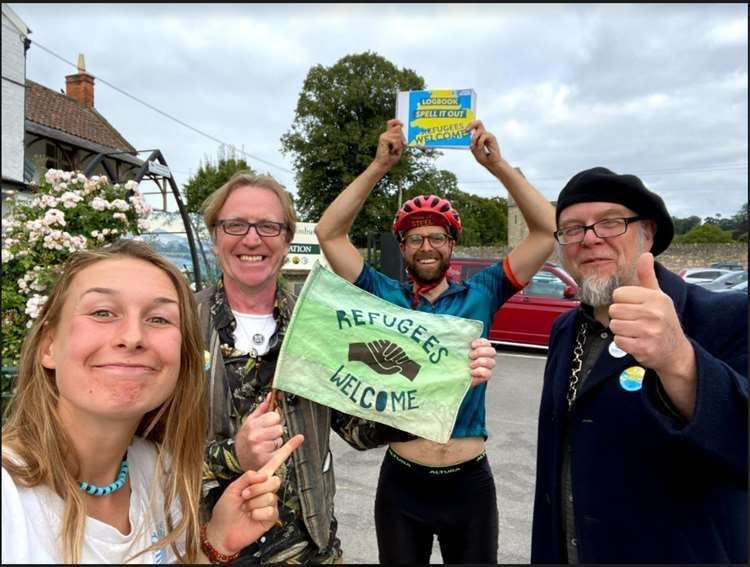 Councillor Brian Outten and Mayor of Glastonbury Jon Cousins with cyclists Georgie Cottle and David Charles. Photo: David Charles/PA