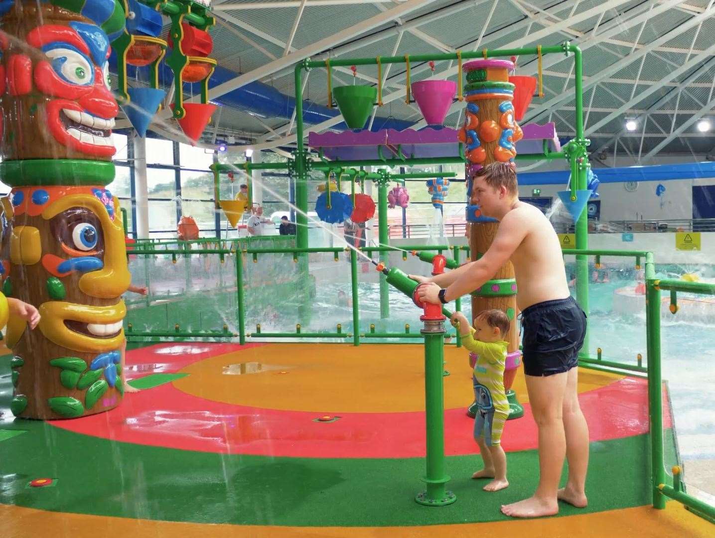 The Aztec-themed splash pad includes totem poles and interactive water features