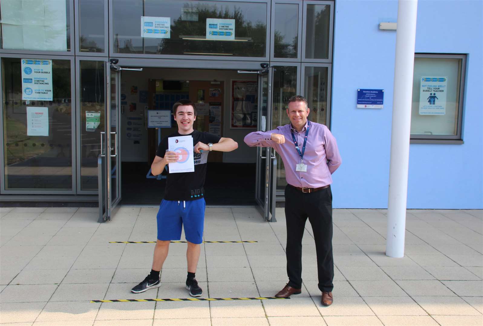 The 2020 handshake: Callum Blanch with Goodwin Academy principal Simon Smith