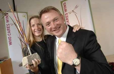 CLEARLY DELIGHTED: Paul and Susi Anderson with the main award. Picture: PAUL DENNIS