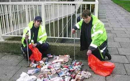 LOADS OF RUBBISH: street cleaners Dominic Casagrande and Boerge Hanssen with debris collected from the St George's roundabout in just a few hours