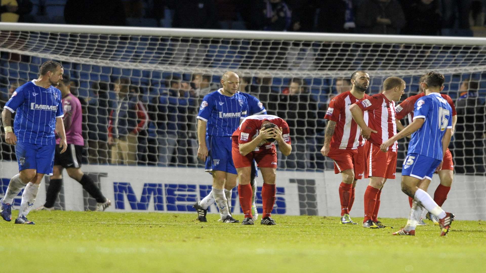 Brackley Town players show their despair at the final whistle after Gills' last-gasp equaliser in the last meeting at Priestfield. Picture: Barry Goodwin