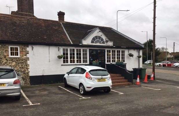 The entrance to the Halfway House in Challock is less imposing from the side bordered by the car park. It sits on a crossroads with a car dealership opposite.