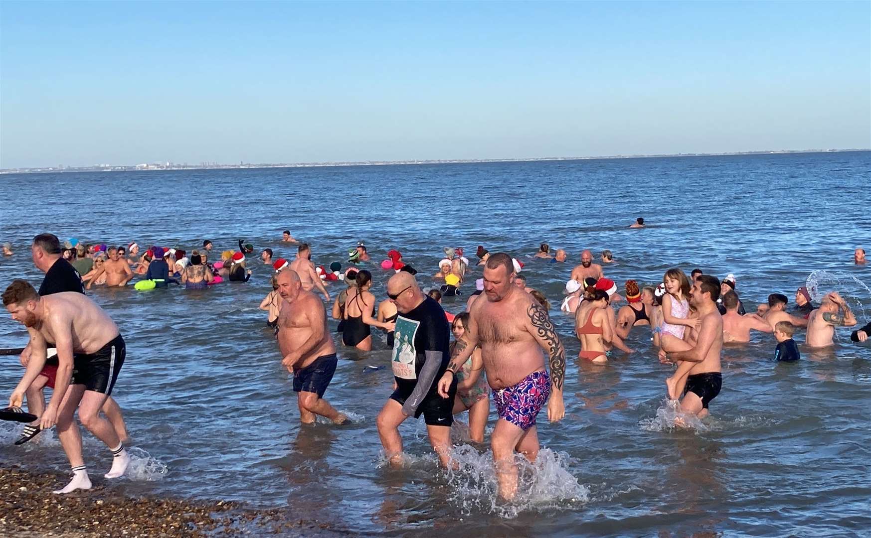 Boxing Day Dip 2023 Sheerness. Crowds took to the water on a sunny Boxing Day morning in Sheerness for the annual dip. Picture: John Nurden