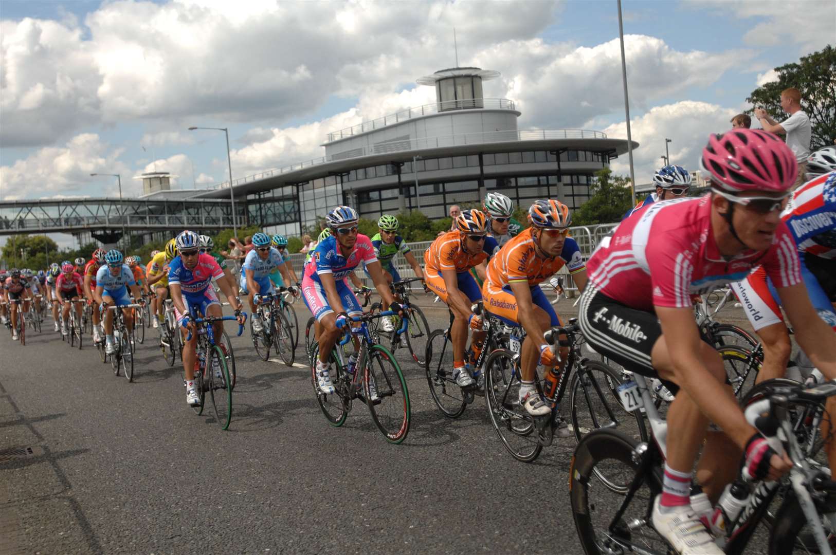 The leading group head towards the Designer Outlet as they pass Ashford International station