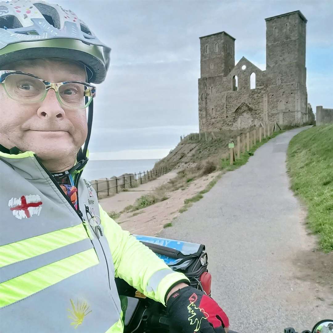 Timmy Mallett on his bike at Reculver Towers. Copyright Timmy Mallett