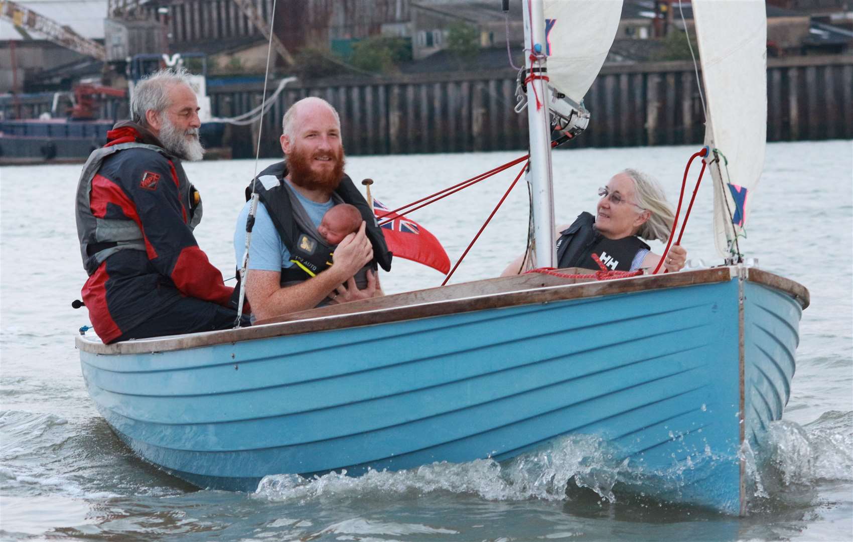 Edward Davies-Mullan, held by dad John, sets sail with maternal grandparents Penny and Steve Davies. Photograph: Andy Barnes