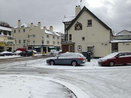 Cars were left abandoned outside the Ship Inn in Sandgate High Street at Sandgate near Folkestone