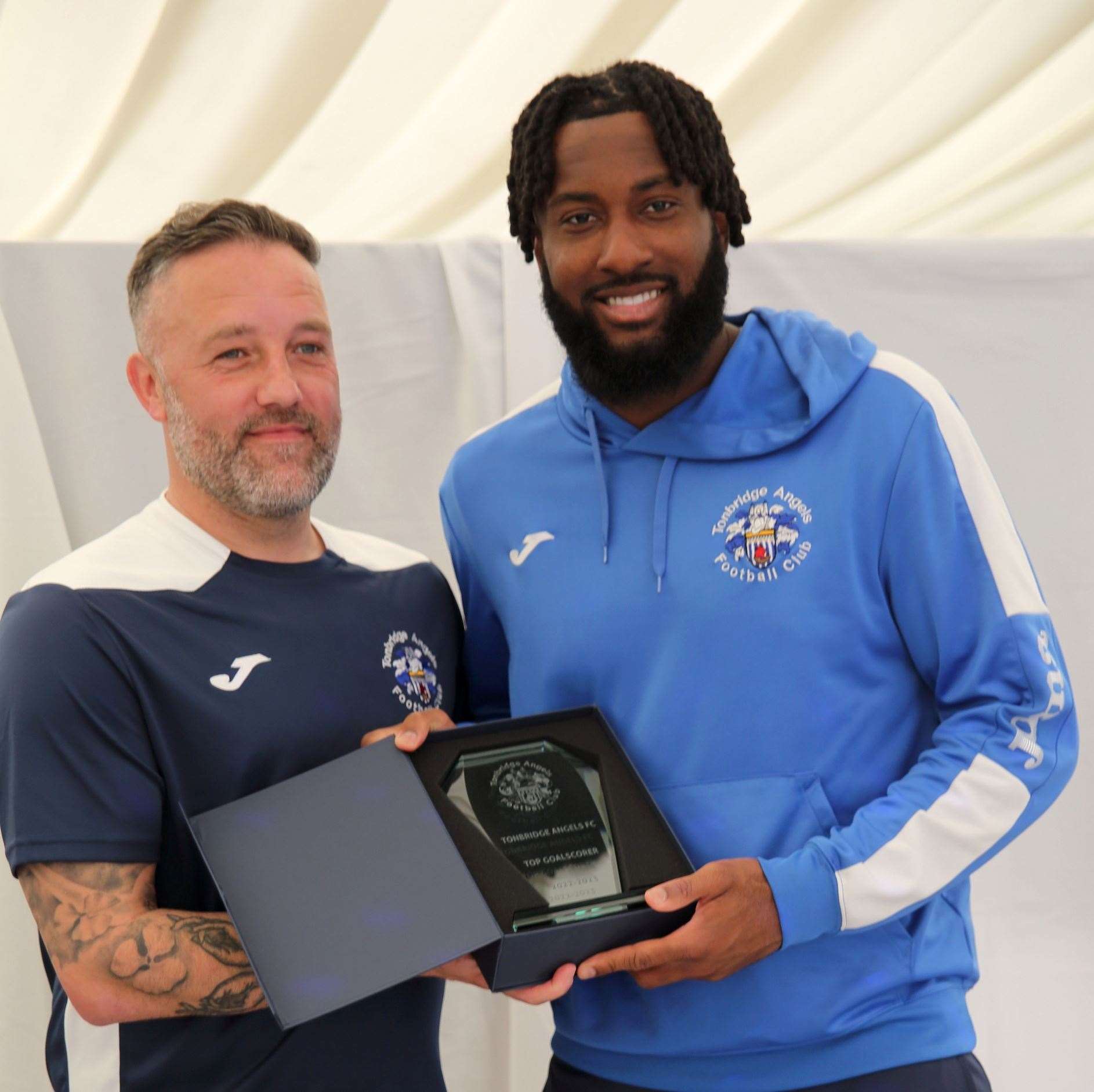 Tonbridge Angels manager Jay Saunders presents the top goalscorer award to Jordan Greenidge last season. Picture: David Couldridge