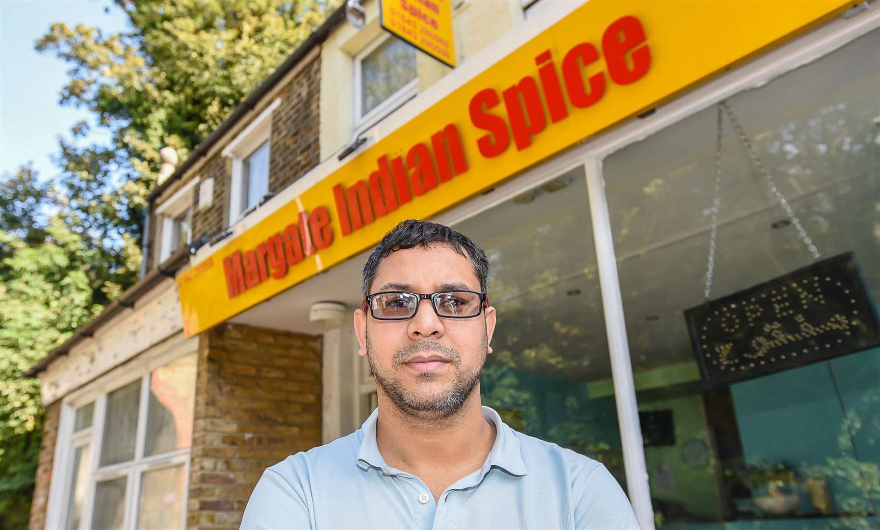 Shahil Uddin outside of the restaurant