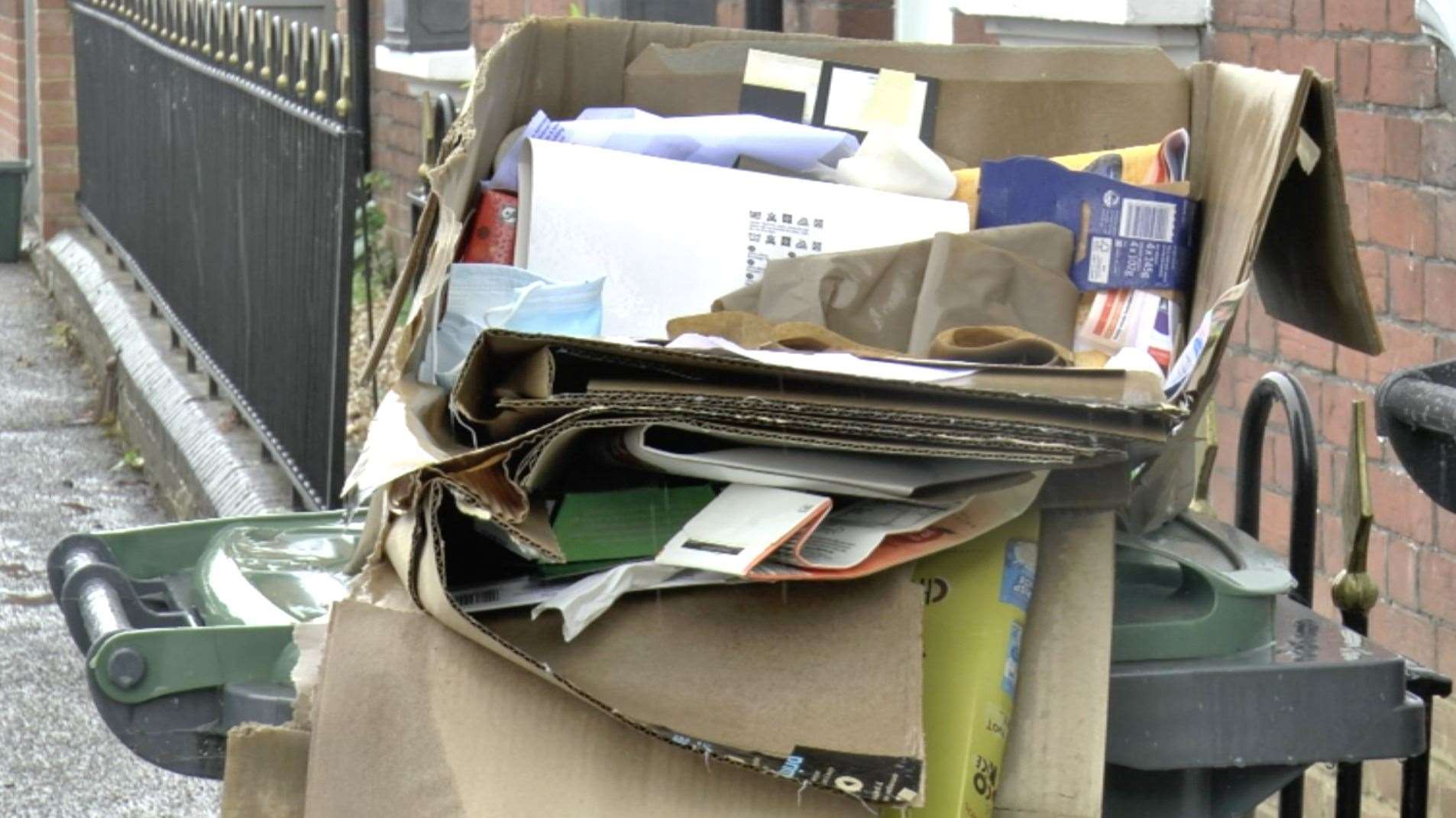 Bins overflowing with rubbish. Stock image.