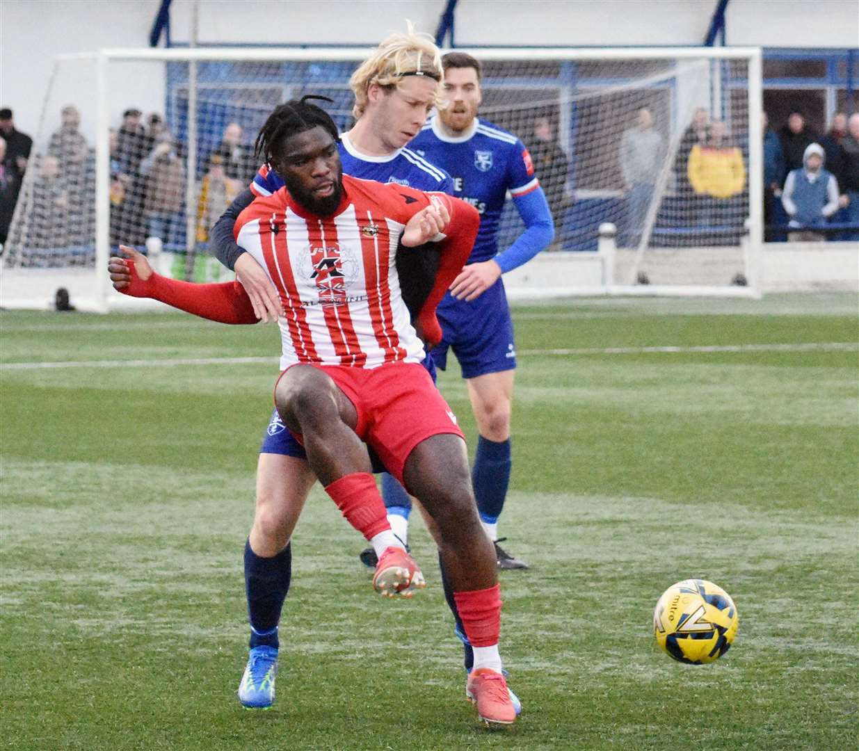 Two-goal Folkestone striker Dave Smith is closed down by Ellis Ashworth in their 2-0 Isthmian Premier win at Margate on New Year’s Day. Picture: Randolph File