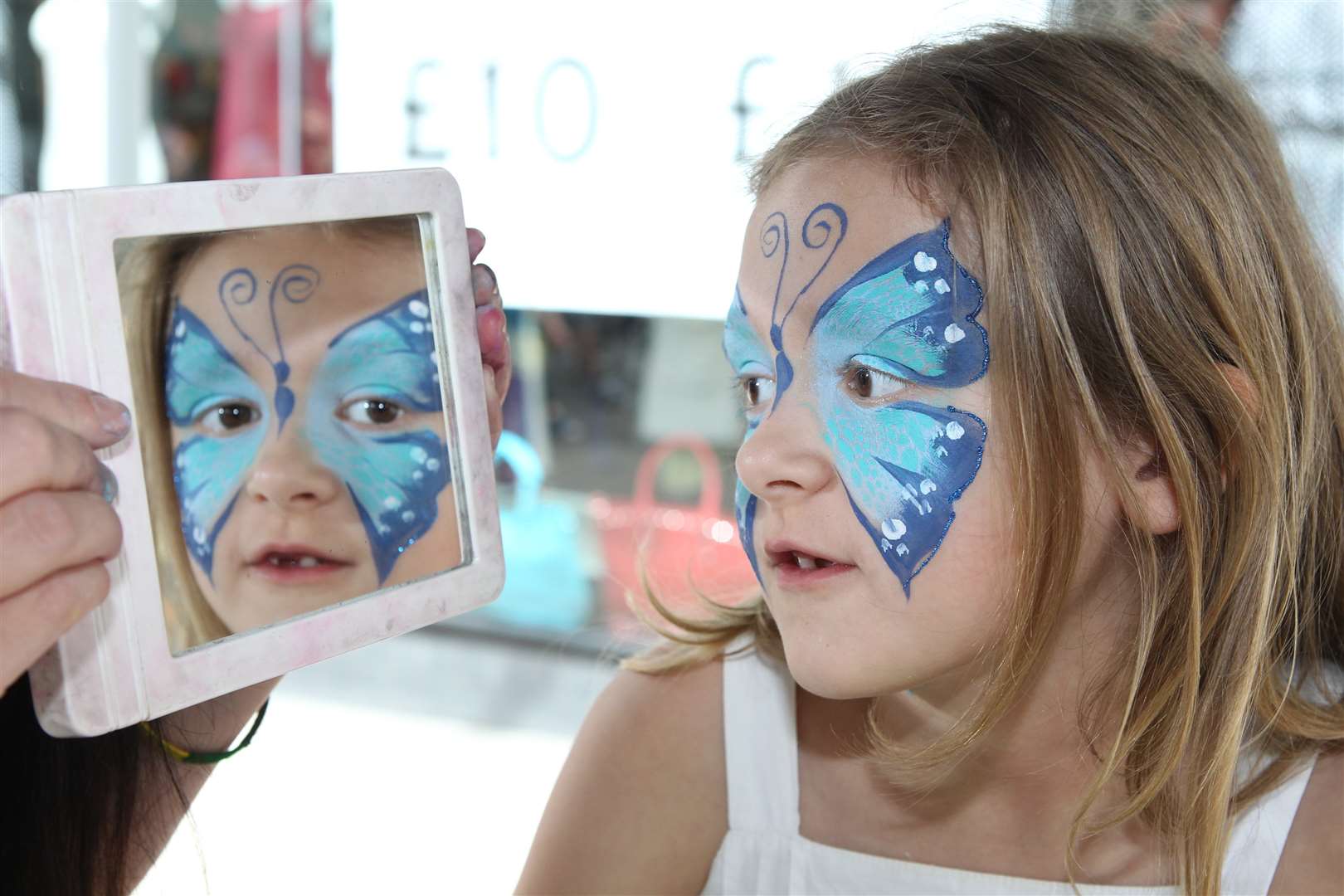 Lydia Bolton, seven, gets her face painted