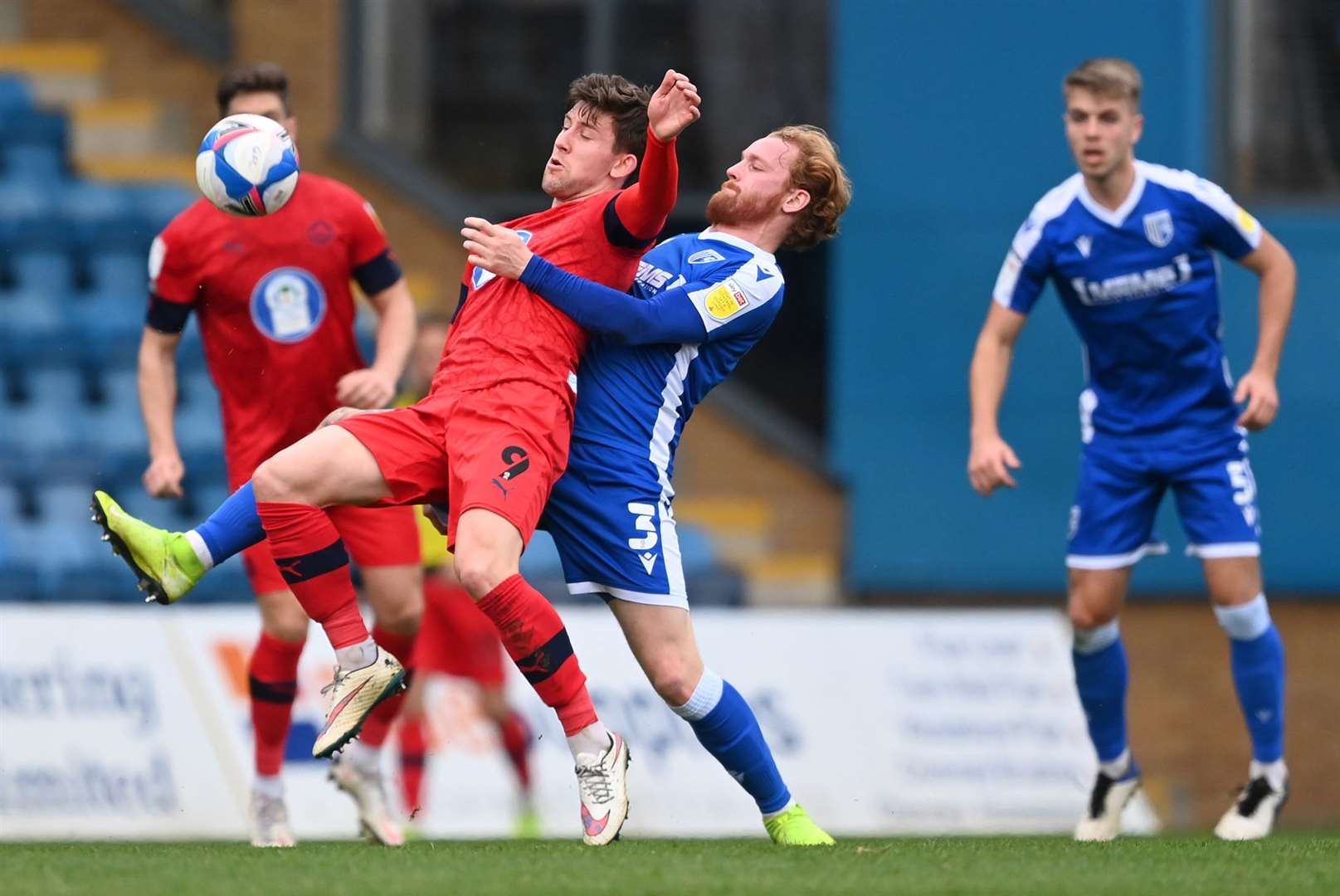 Gills defender Connor Ogilvie gets tight to Wigan's Callum Lang. Picture: Keith Gillard