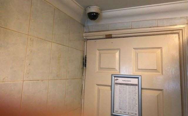 There is CCTV in the toilet, sitting above the door, which also has the cleaning rota pinned to it