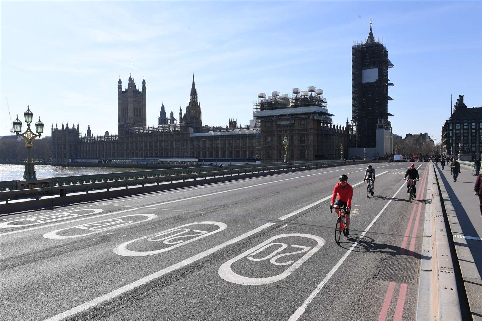 Cyclists ride across an empty Westminster Bridge (Stefan Rousseau/PA)