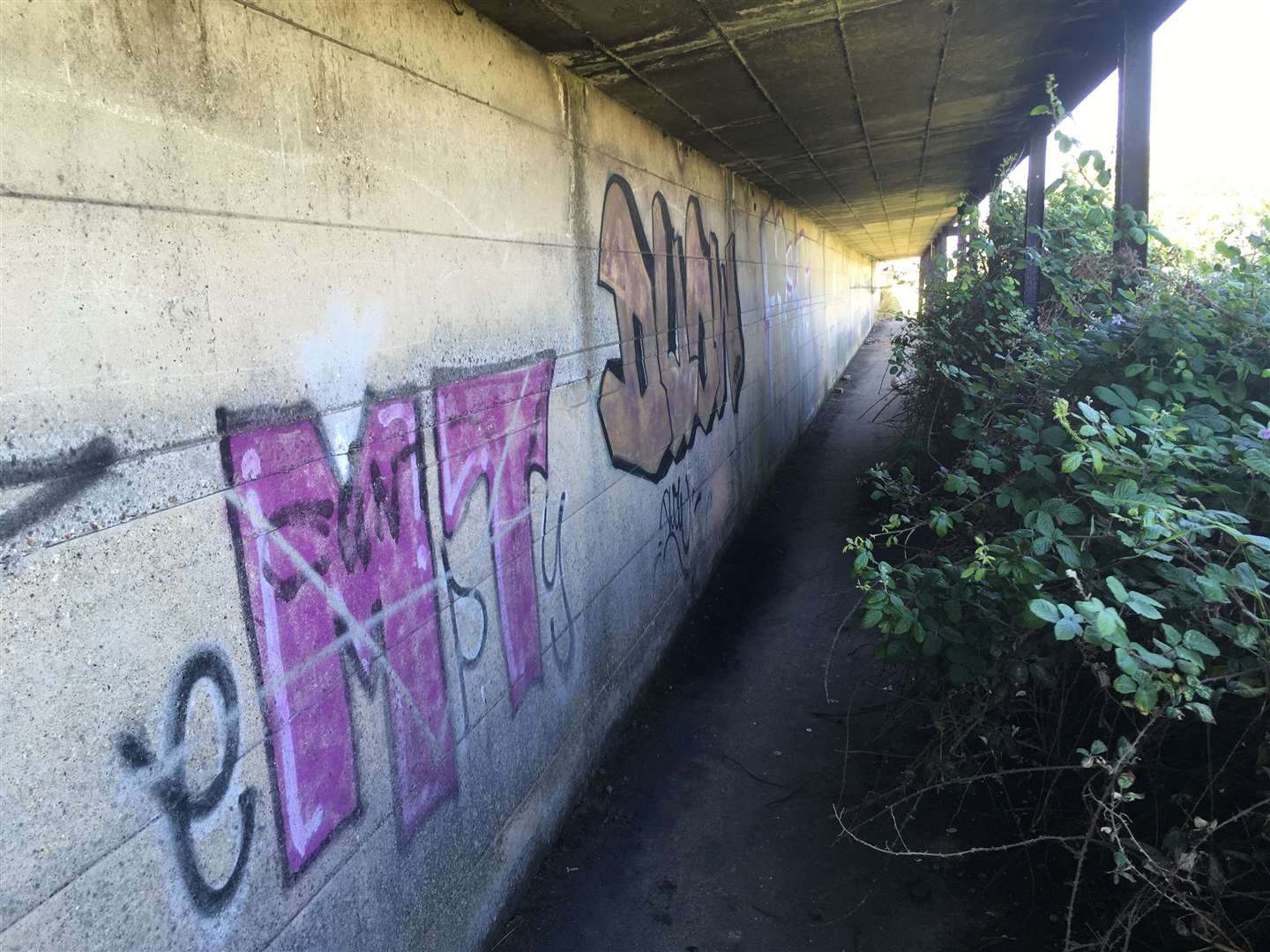 The state of the covered way at Sheerness on Sheppey last summer with graffiti and dangerous gaps in its concrete roof