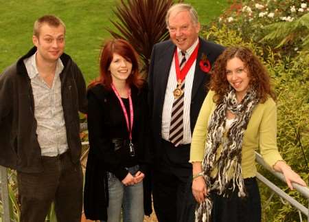 Three young people who have found careers through volunteering chat to KCC's Chairman Leyland Ridings in the grounds of Canterbury Christchurch. Left to right Matthew Finch; Zoe Medcalf: Leyland Ridings and Karly Vickers.