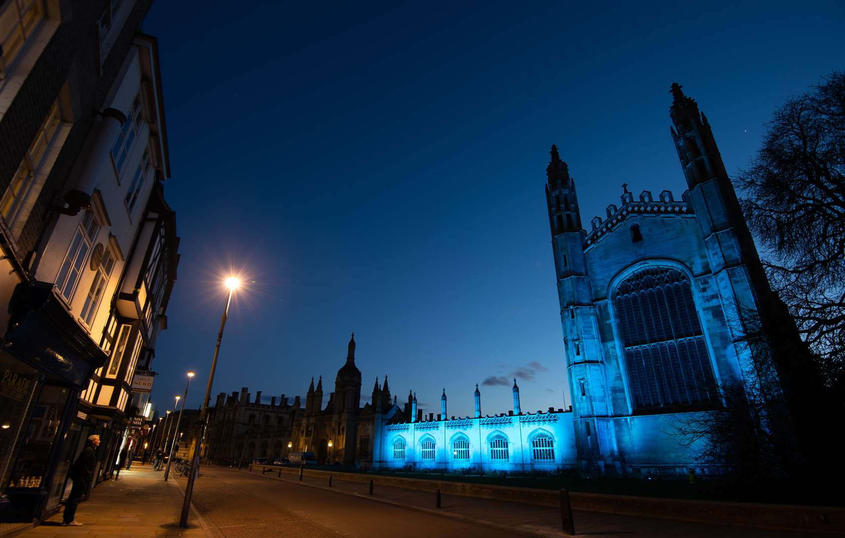 King’s College at Cambridge University is bathed in blue light to salute local health service heroes (Joe Giddens/PA)