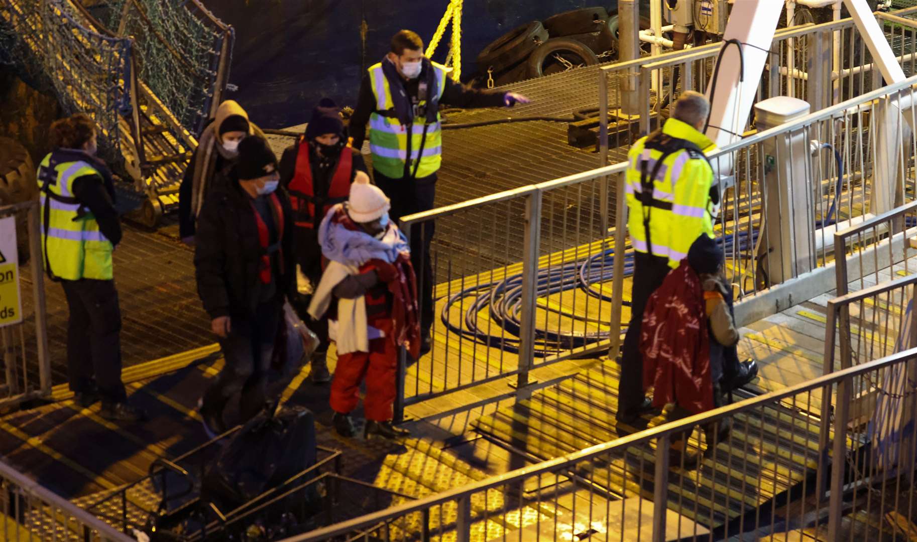 Migrants arriving at Dover on the Border Force boat Hurricane after being picked up near Ramsgate. Photo: UK News In Pictures