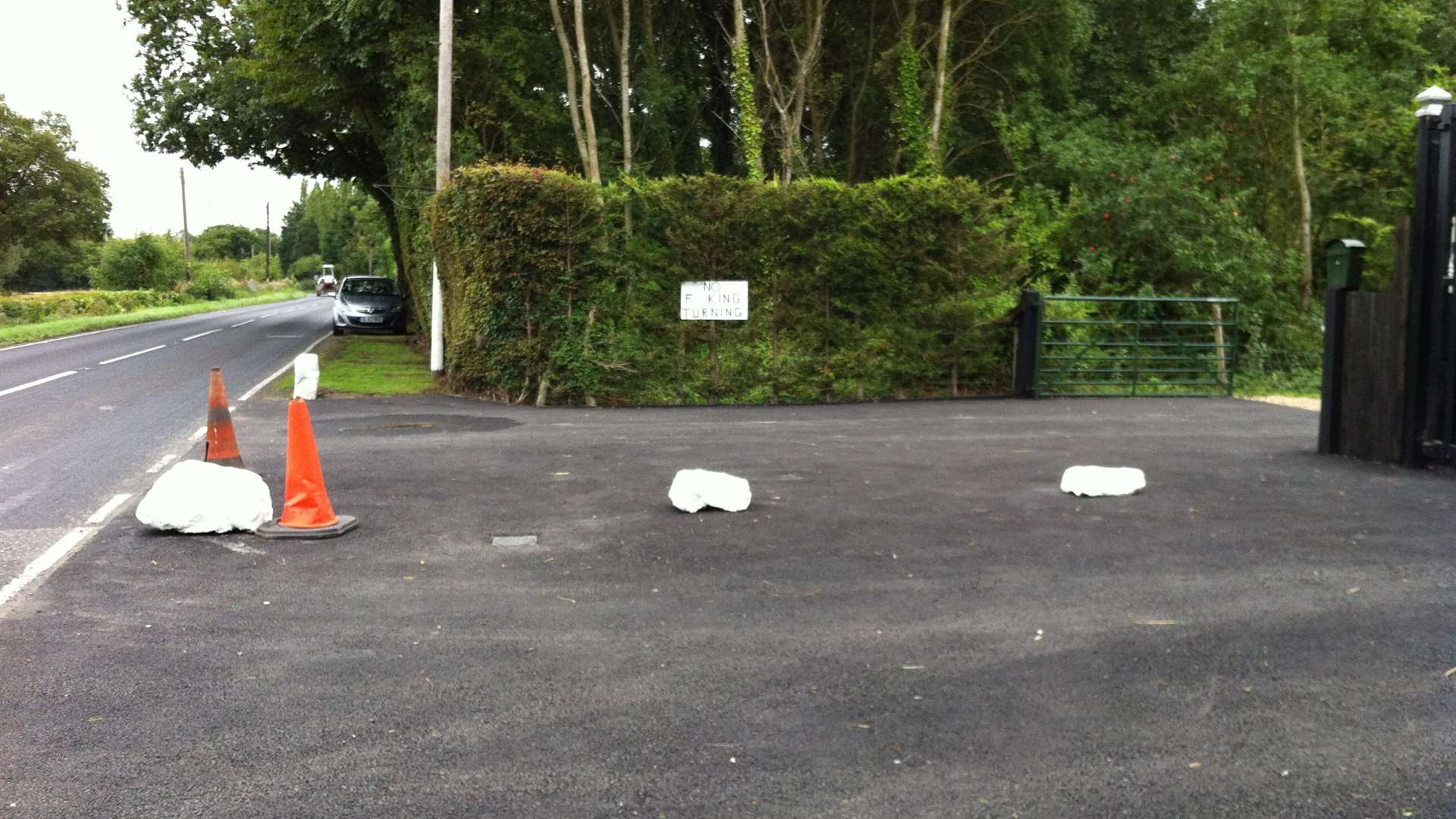 The owner has also cordoned off the driveway with cones and boulders.