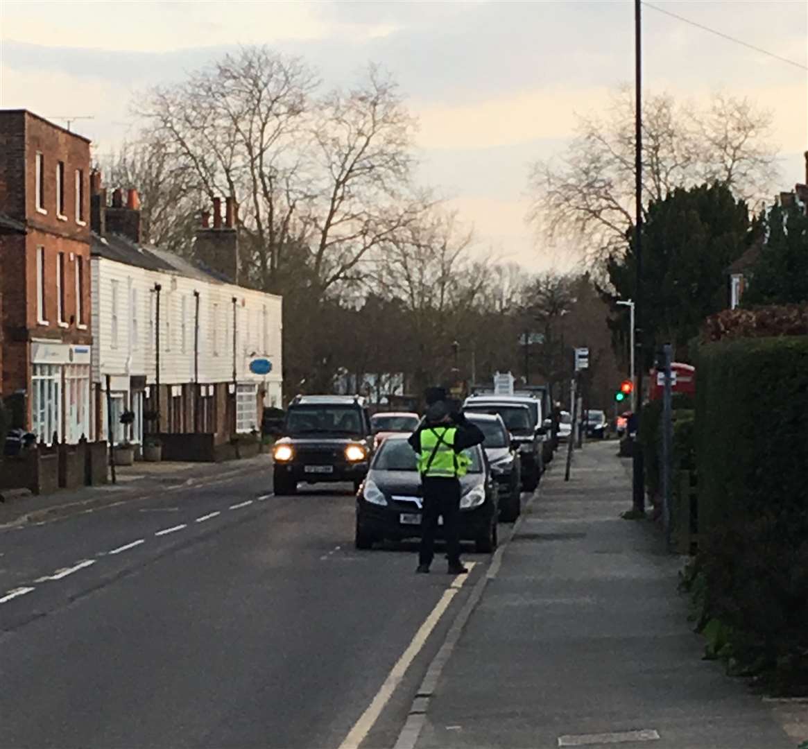 A parking warden at work in Tenterden