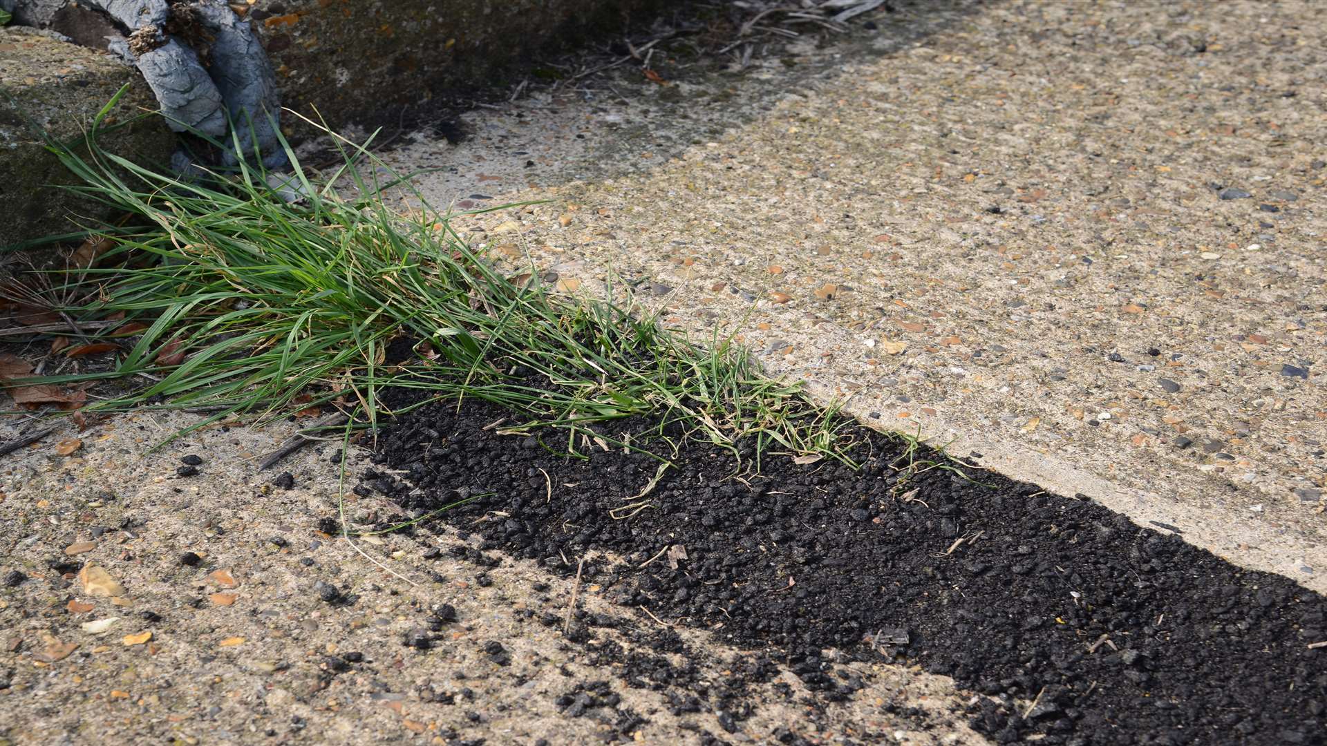 A close-up of the badly repaired pathway