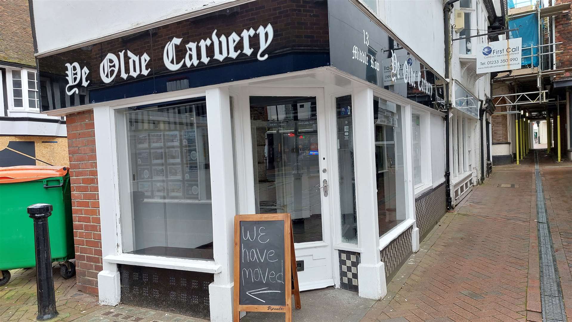 Signs by the old shop direct customers to the new cafe