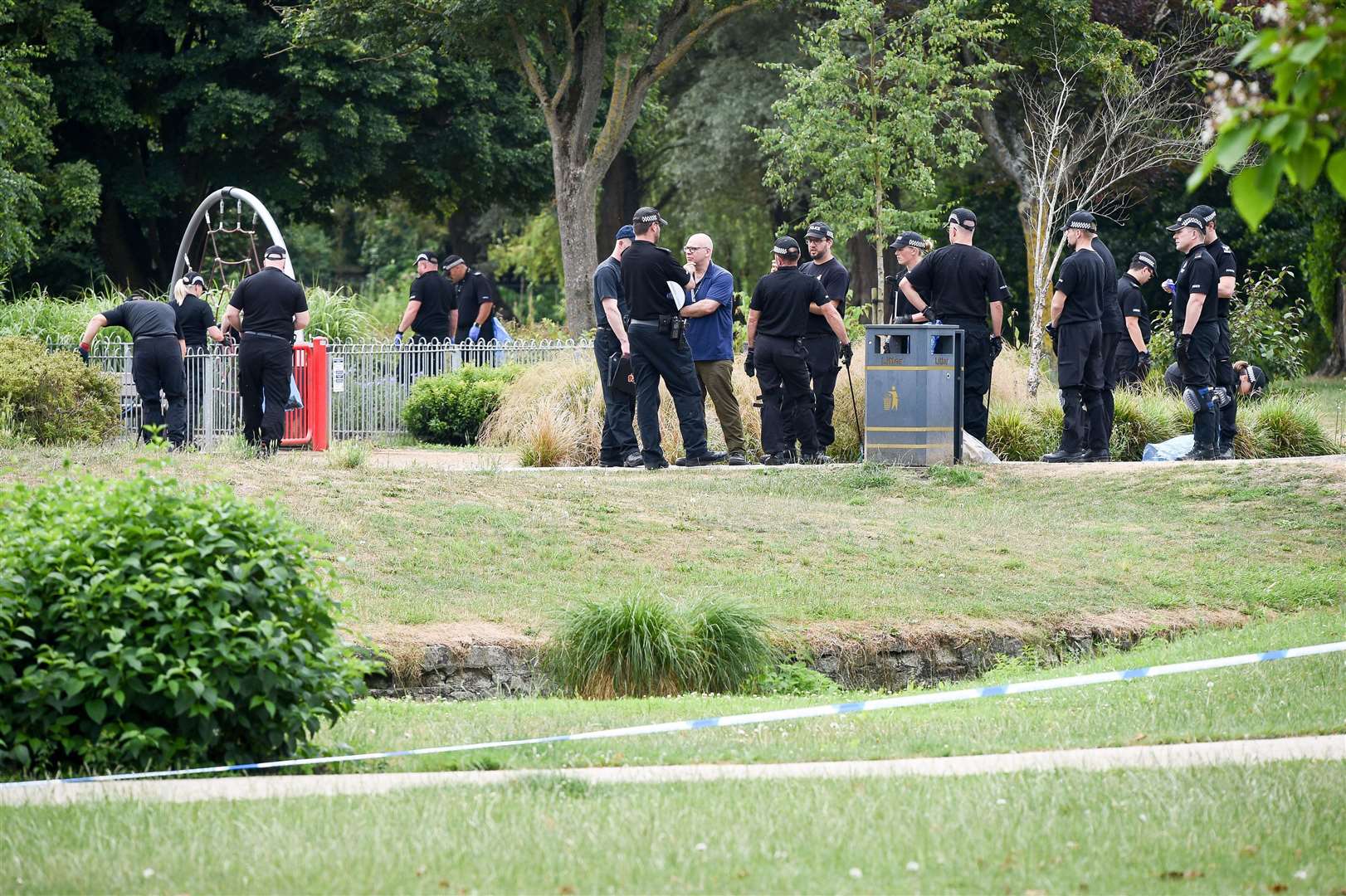 Police conduct searches of Queen Elizabeth Gardens, Salisbury, where Dawn Sturgess visited before she fell ill after coming into contact with Novichok (Ben Birchall/PA)