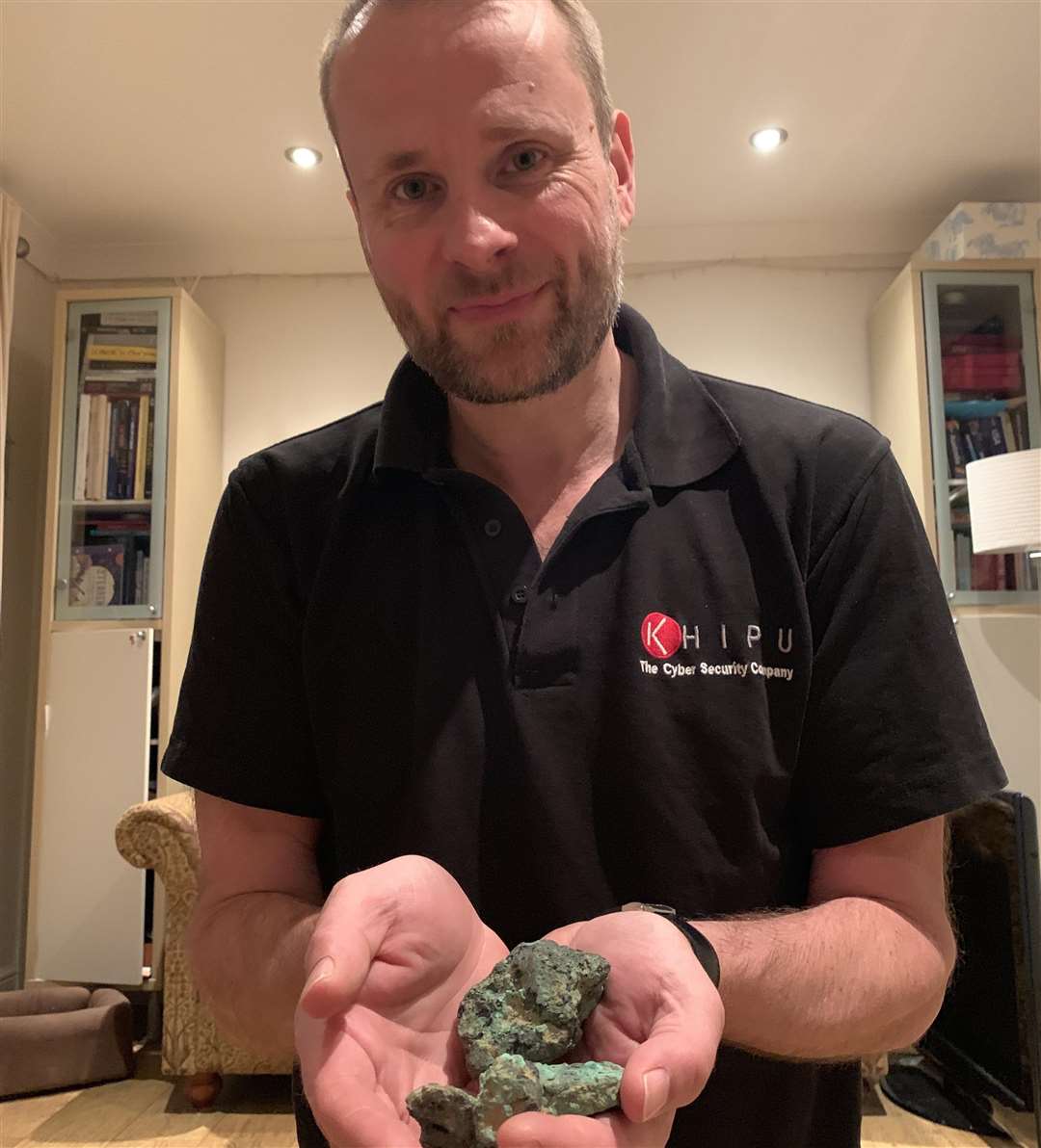 Mr Revell holding some of the ingot fragments