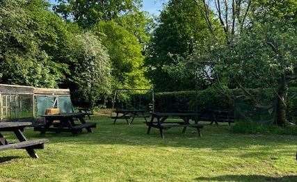 There are two separate play areas for the kids with a set of swings at the far end of the garden