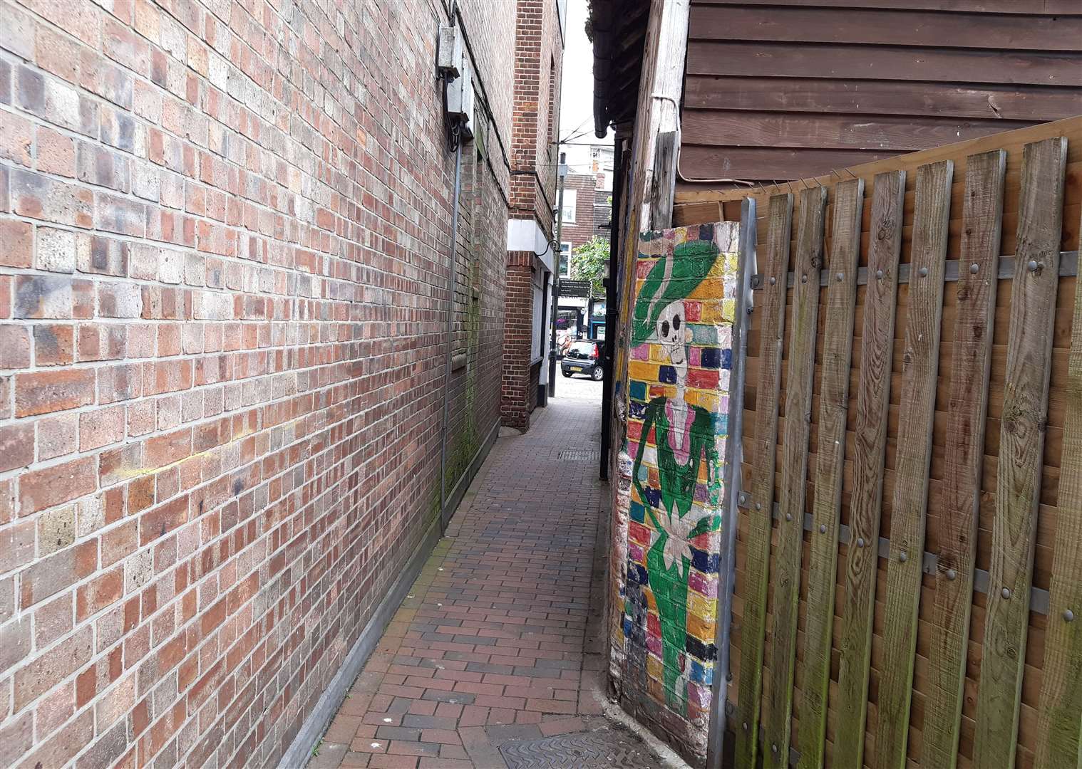 The narrow St John's Lane runs alongside the former bingo hall, linking the Vicarage Lane car park with the Lower High Street