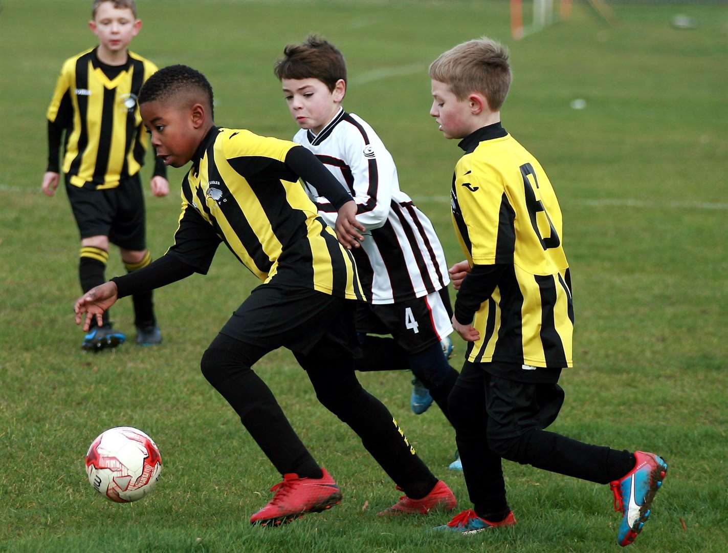 Rainham Eagles under-9s (yellow/black) battle Milton and Fulston United Athletic under-9s Picture: Phil Lee