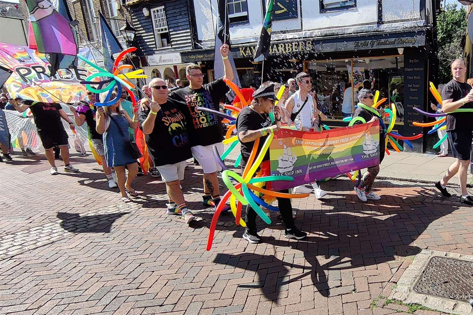 People were seen carrying balloons and flags. Picture: Steve Morton