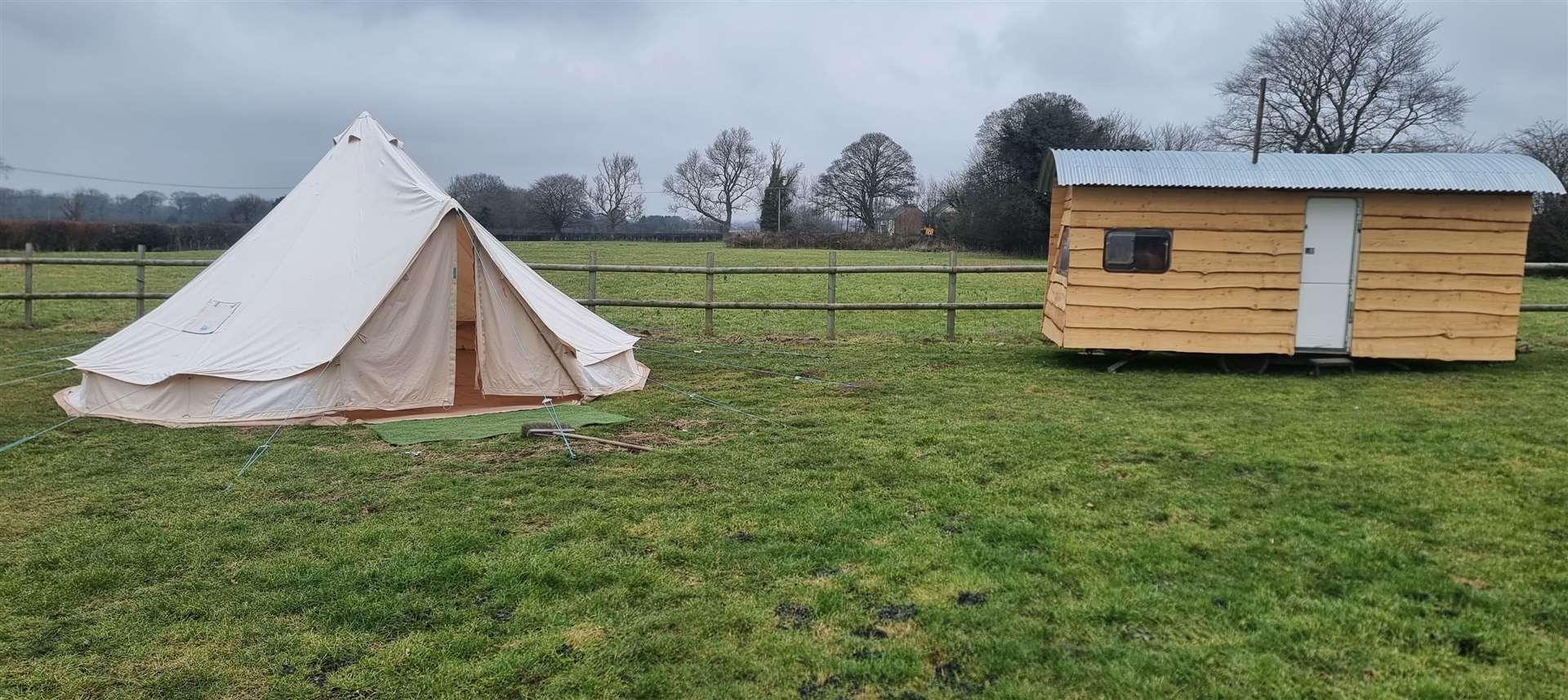 A bell tent and a shepherd's hut are available for campers to stay in