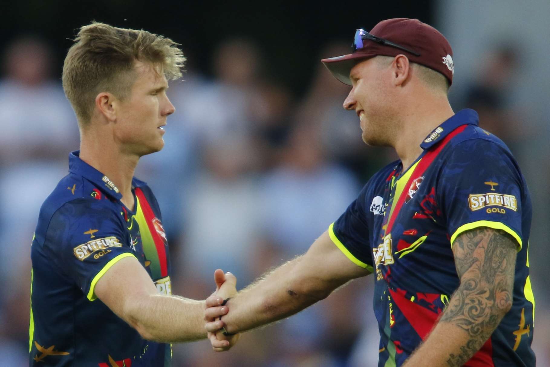 Matt Coles celebrates a wicket with Jimmy Neesham. Picture: Andy Jones.