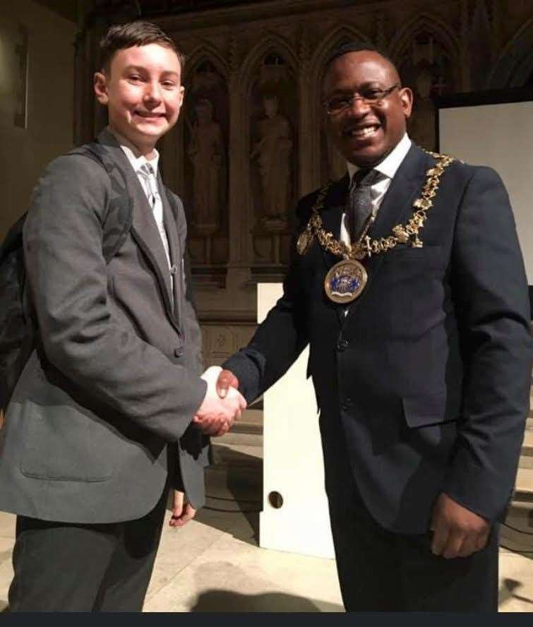 Oliver Tomlin, then 11, with then mayor Habib Tejan