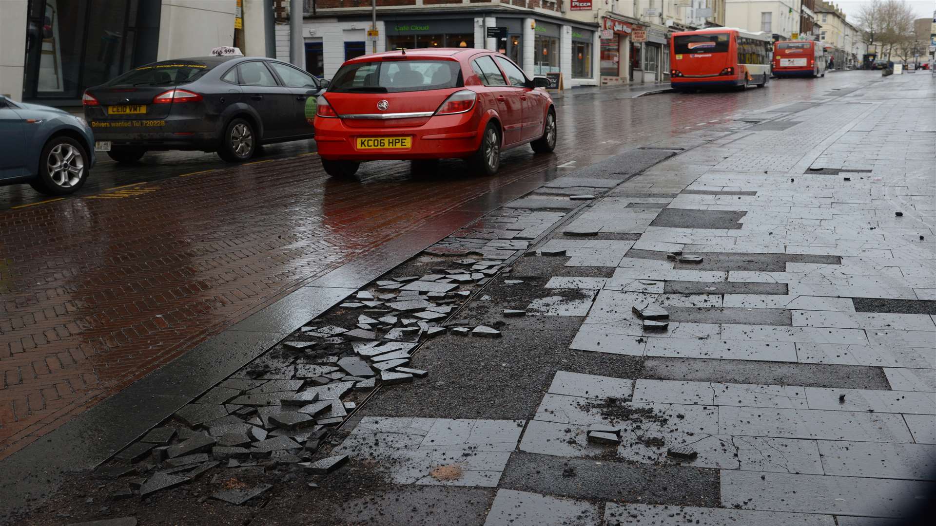 Damaged paving at the bottom of Bank Street