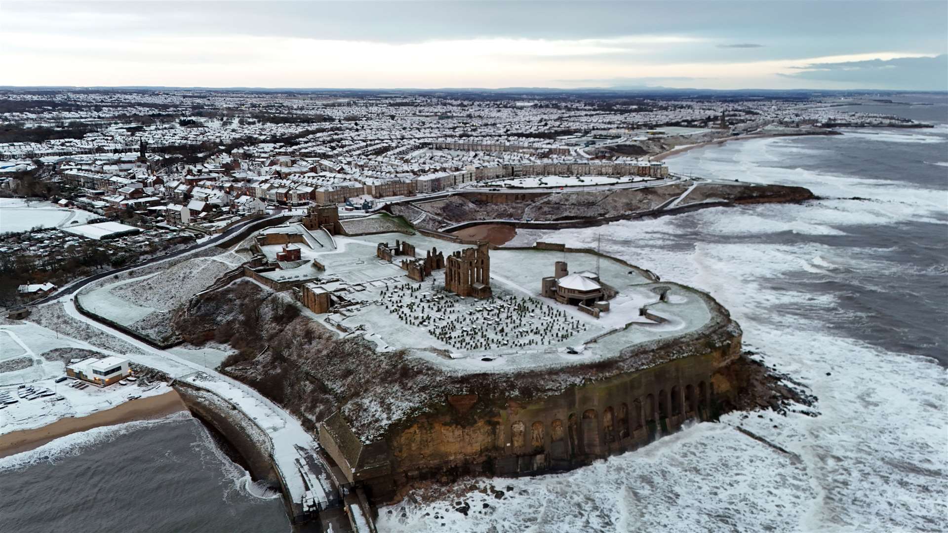 Overnight snow covers Tynemouth Priory in North Tyneside (Owen Humphreys/PA)