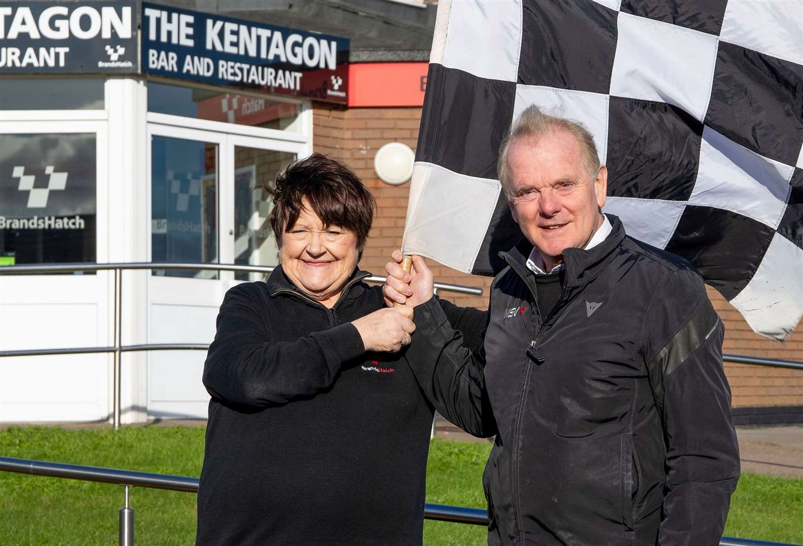 The chequered flag has finally fallen on Mandy Scott's long career at Brands Hatch. She's pictured outside the Kentagon restaurant with Jonathan Palmer