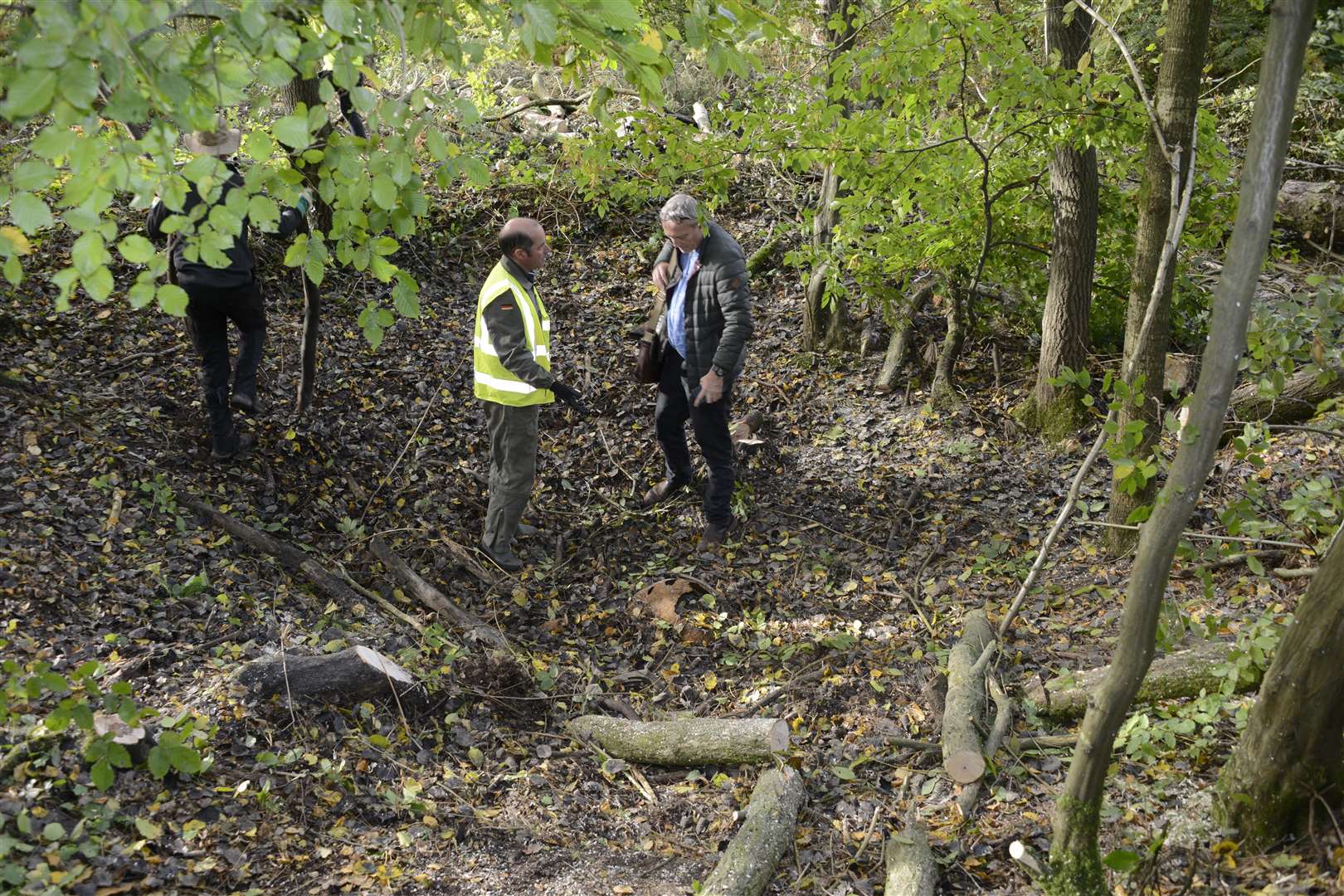 Colin Welch from Research Resources in the crater chatting to a volunteer. Picture: Paul Amos.