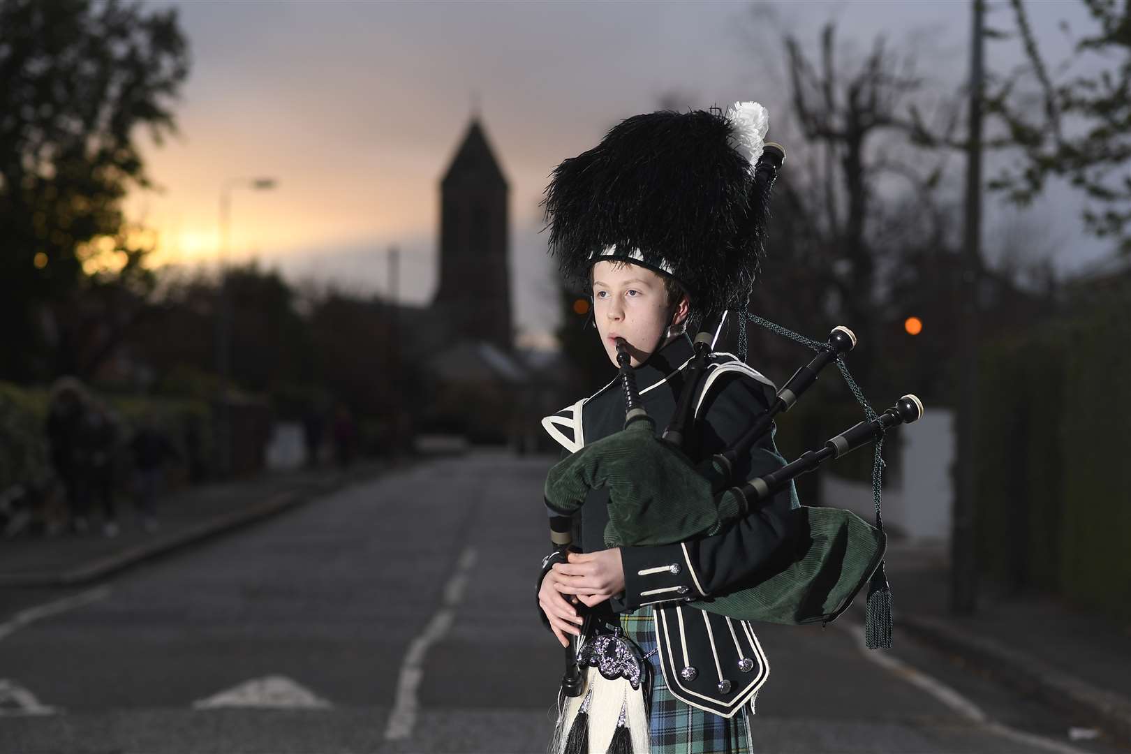 Twelve–year-old George Orchin plays Scotland The Brave in East Belfast, Northern Ireland (Michael Cooper/PA)