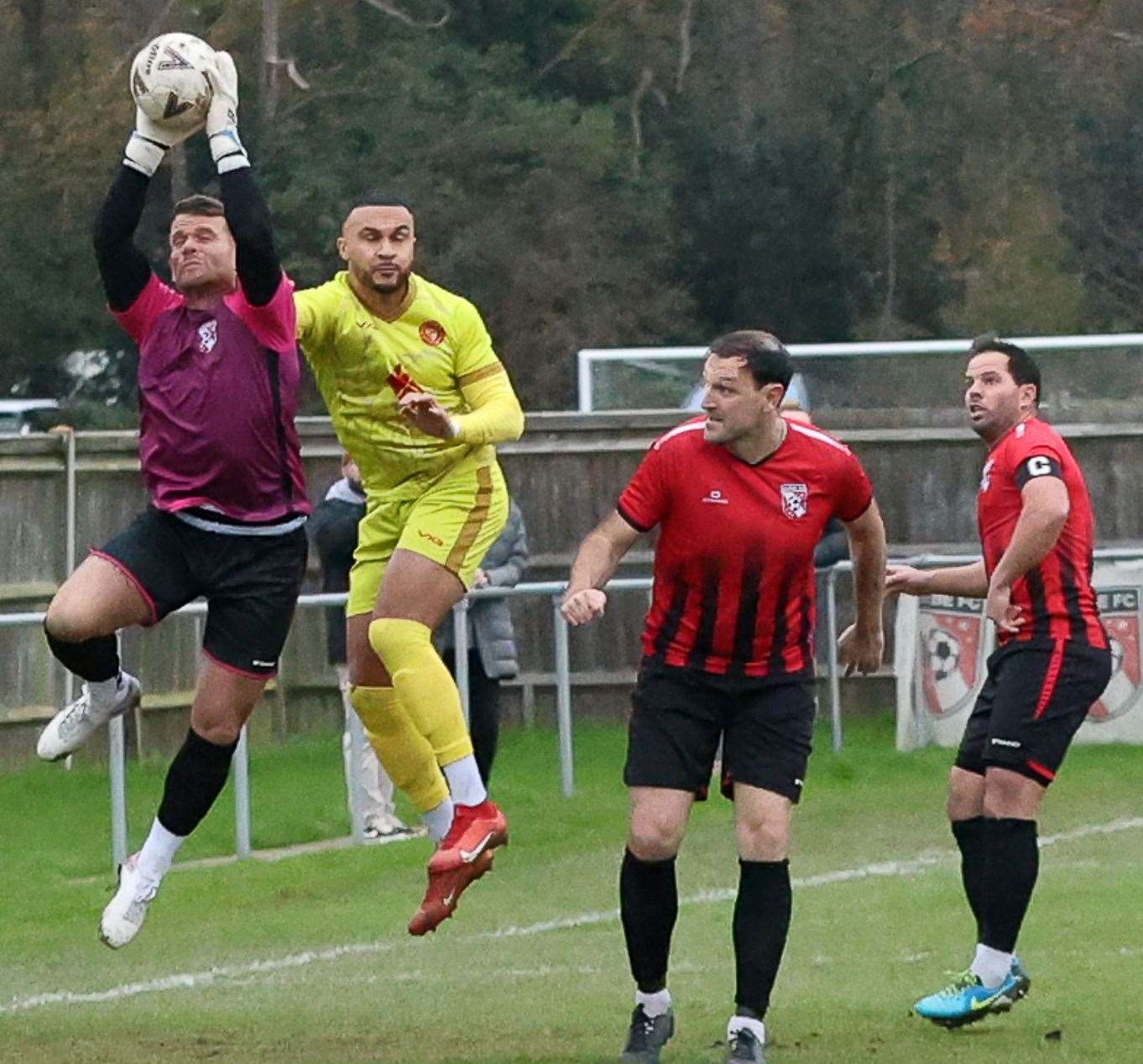 Glebe keeper Justin Lee beats experienced striker Dean Grant to the ball in Whitstable’s 2-1 weekend loss. Picture: Les Biggs