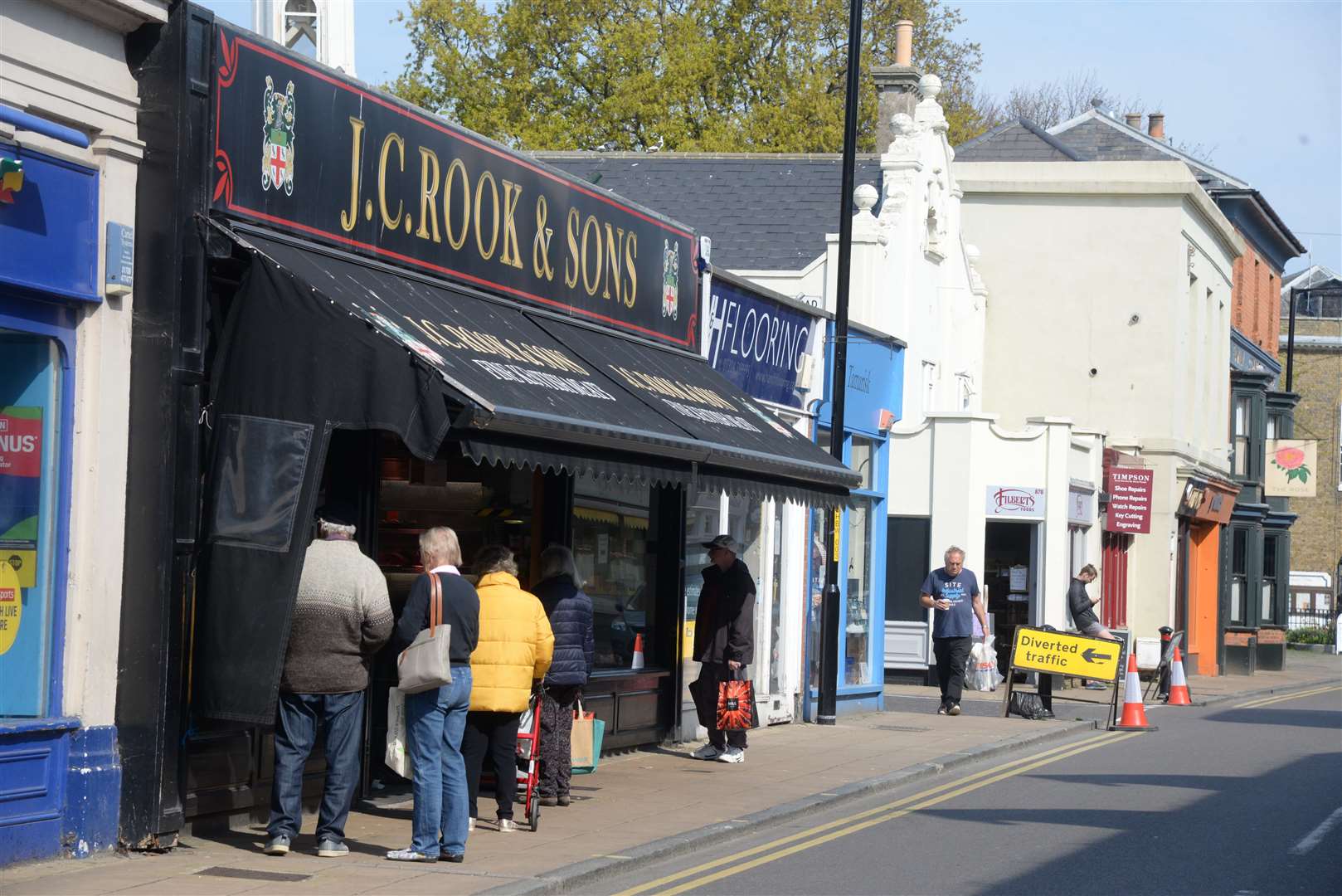 Some shoppers have been forced to step into the road to social distance in Deal High Street. Picture: Chris Davey