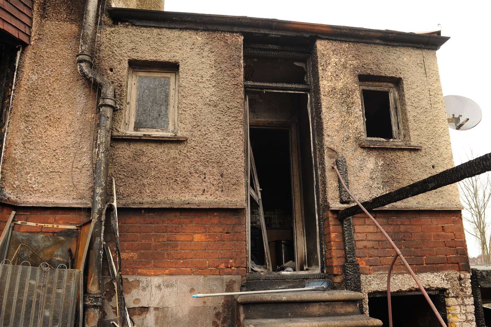 The charred entrance to the home