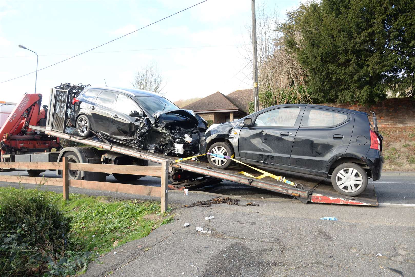 The damaged cars being recovered.