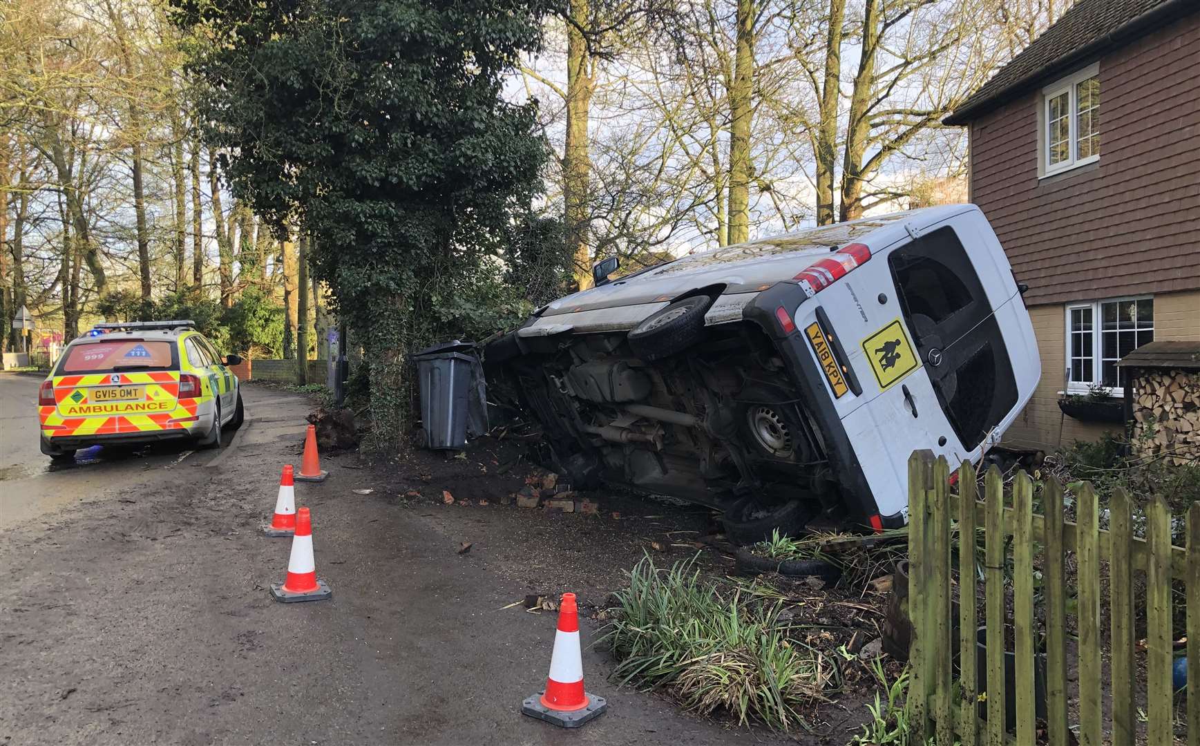 The minibus crashed into a front garden in Eyhorne Street. Picture: Adam Ward