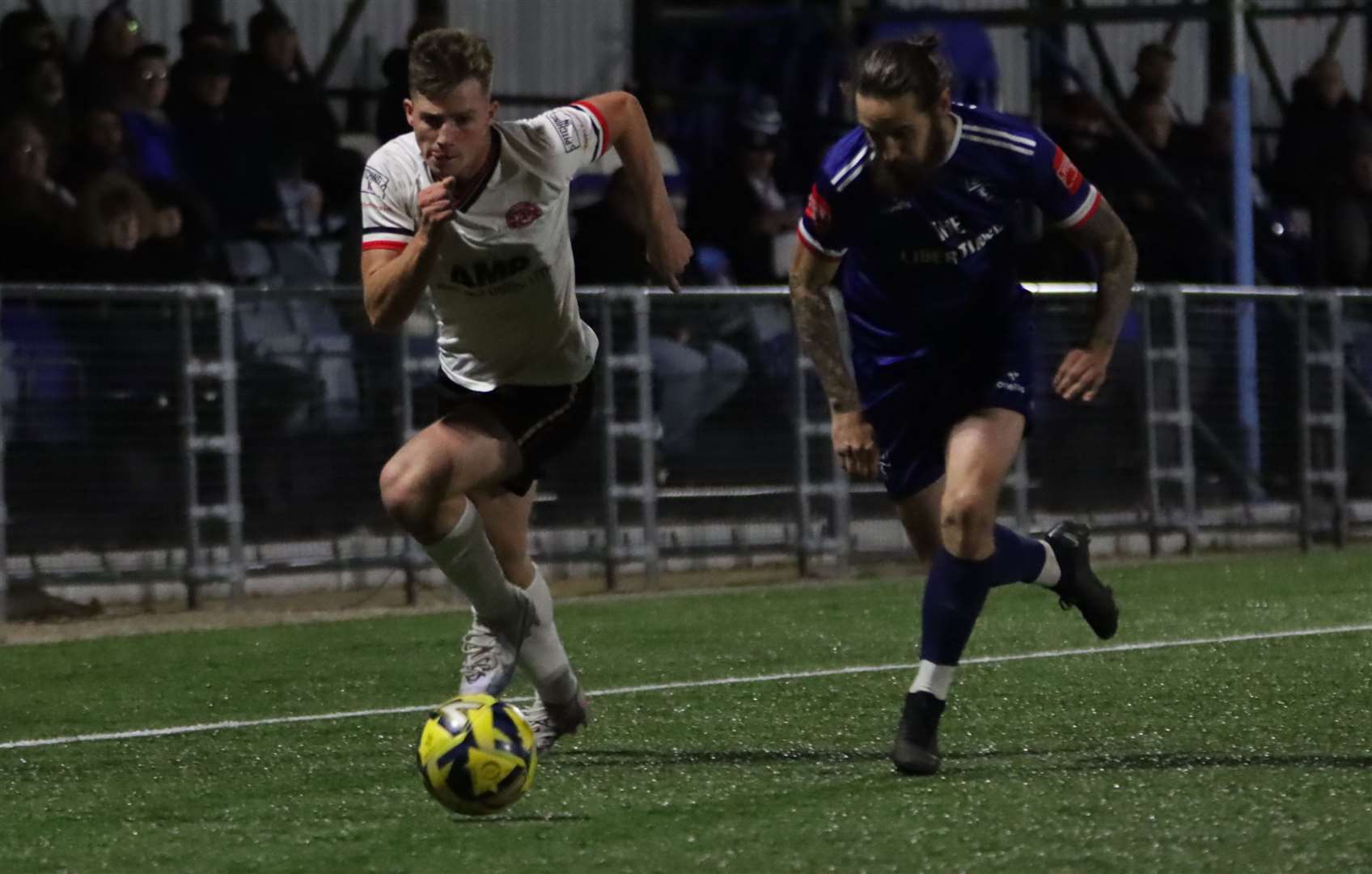 Margate left-back Archie Johnson comes up against Chatham's on-loan Charlton right-back Ollie Hobden. Picture: Max English @max_ePhotos